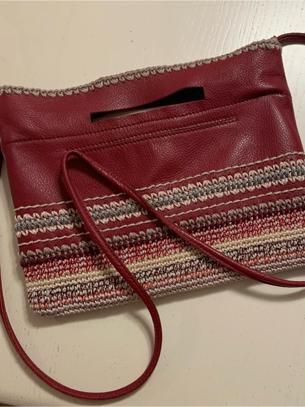 The Sak crimson woven-trim crossbody bag